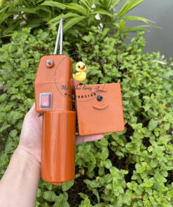 Cục pin rời của máy nhỏ lông măng vịt lò xo màu cam